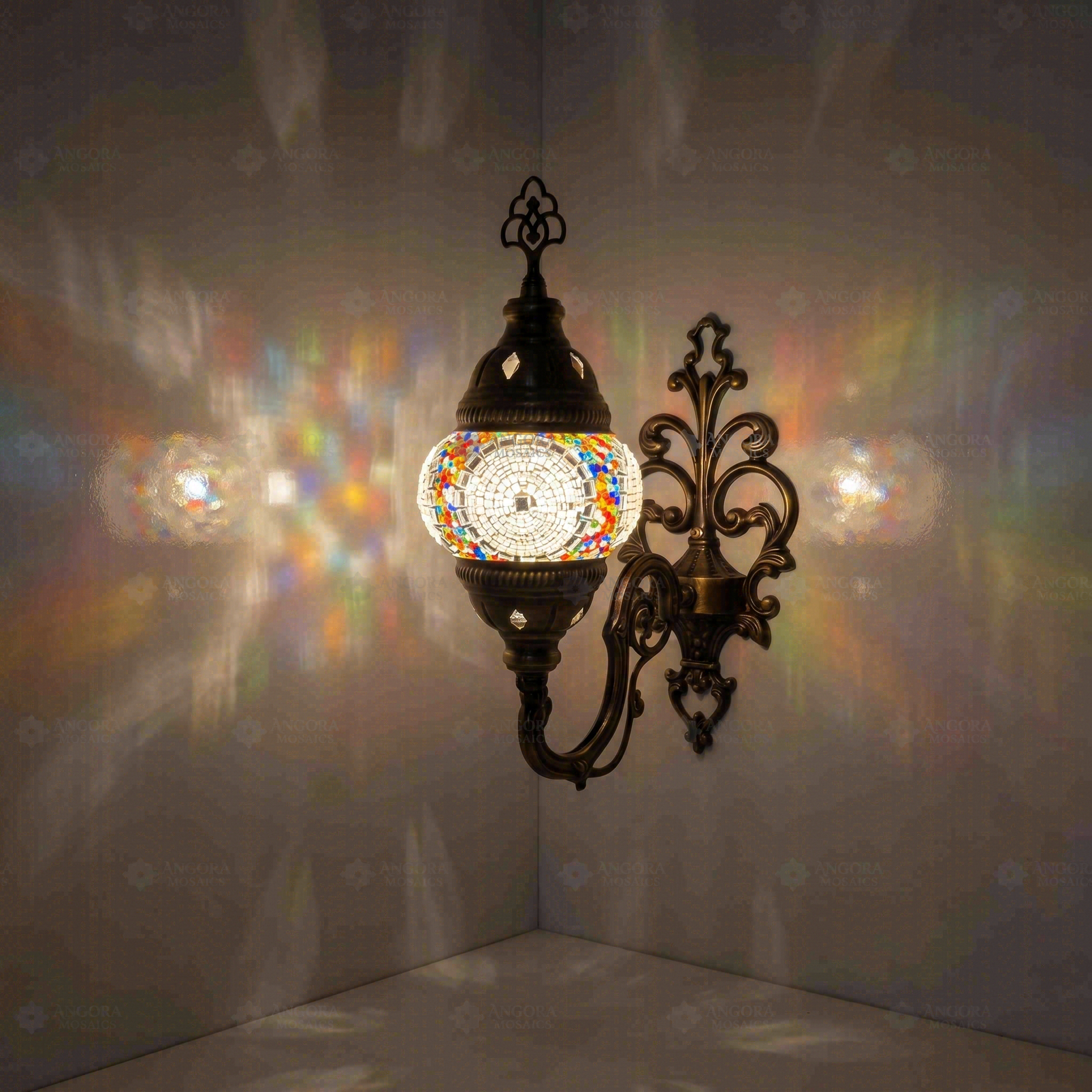 Multicolor Turkish mosaic wall sconce illuminated, showing colorful light projection (ENV APN1013)