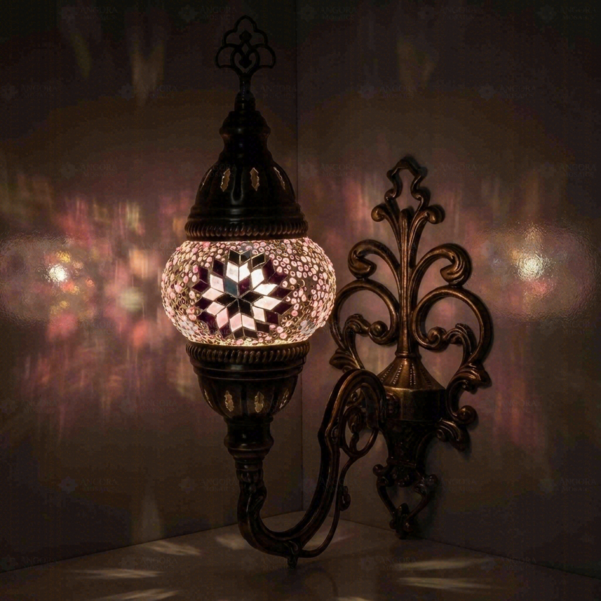 Pink Turkish mosaic wall sconce illuminated, showing colorful light projection (ENV APN1034)