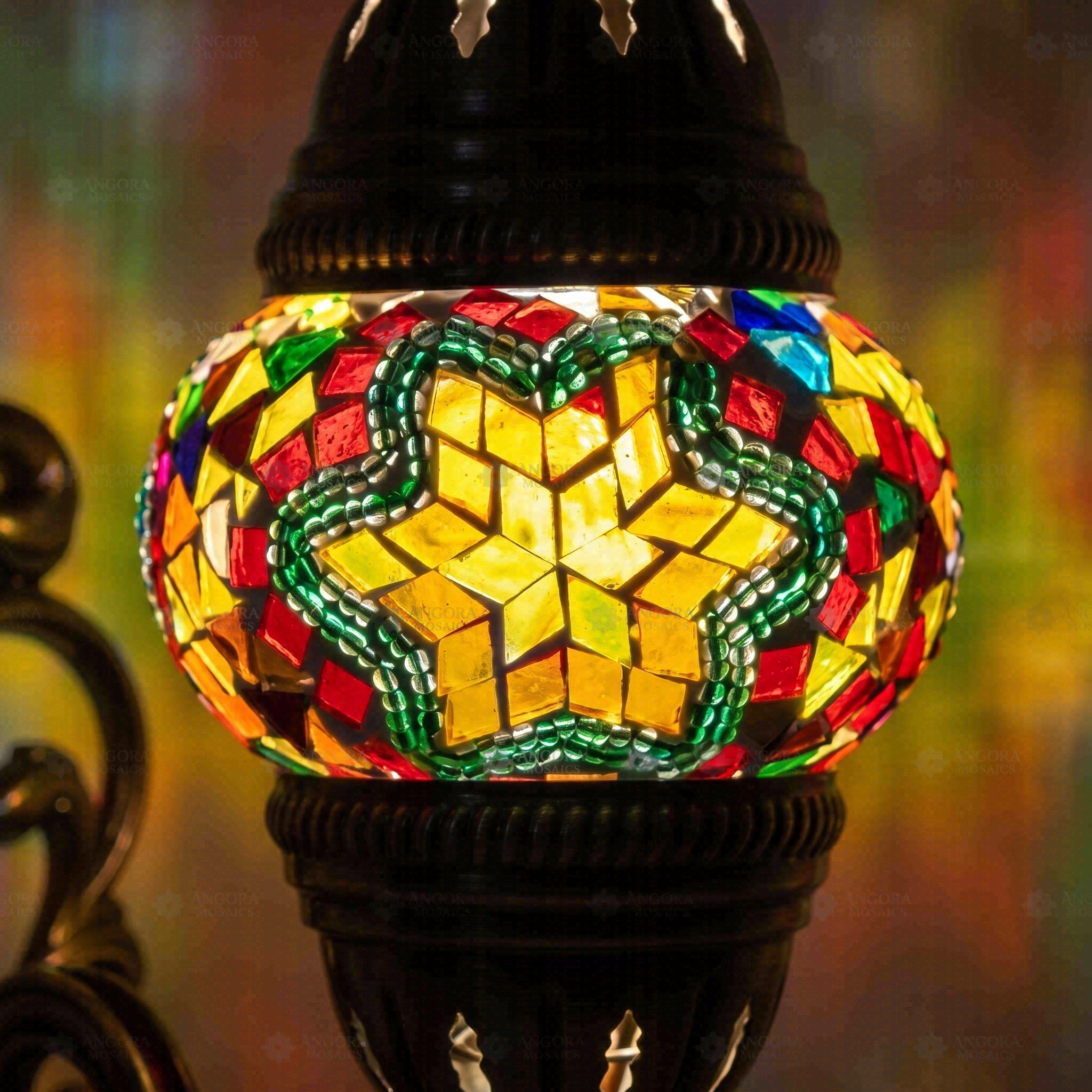 Lit close-up of mosaic glass globe — Multicolor wall sconce glowing (ENV APN1042)