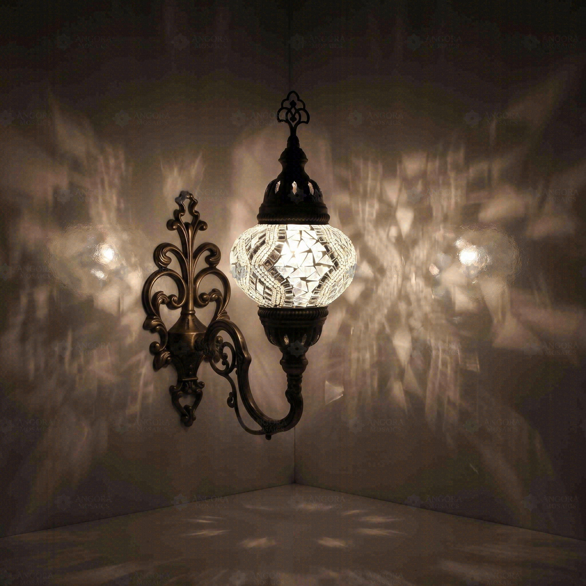 White Turkish mosaic wall sconce illuminated, showing colorful light projection (ENV APN2017)