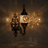 Amber Turkish mosaic wall sconce illuminated, showing colorful light projection (ENV APN2118)