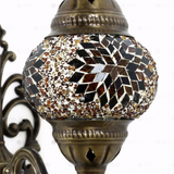 Close-up of Amber warm amber mosaic glass globe pattern — wall sconce (ENV APN2118)