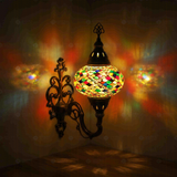 Multicolor Turkish mosaic wall sconce illuminated, showing colorful light projection (ENV APN3002)