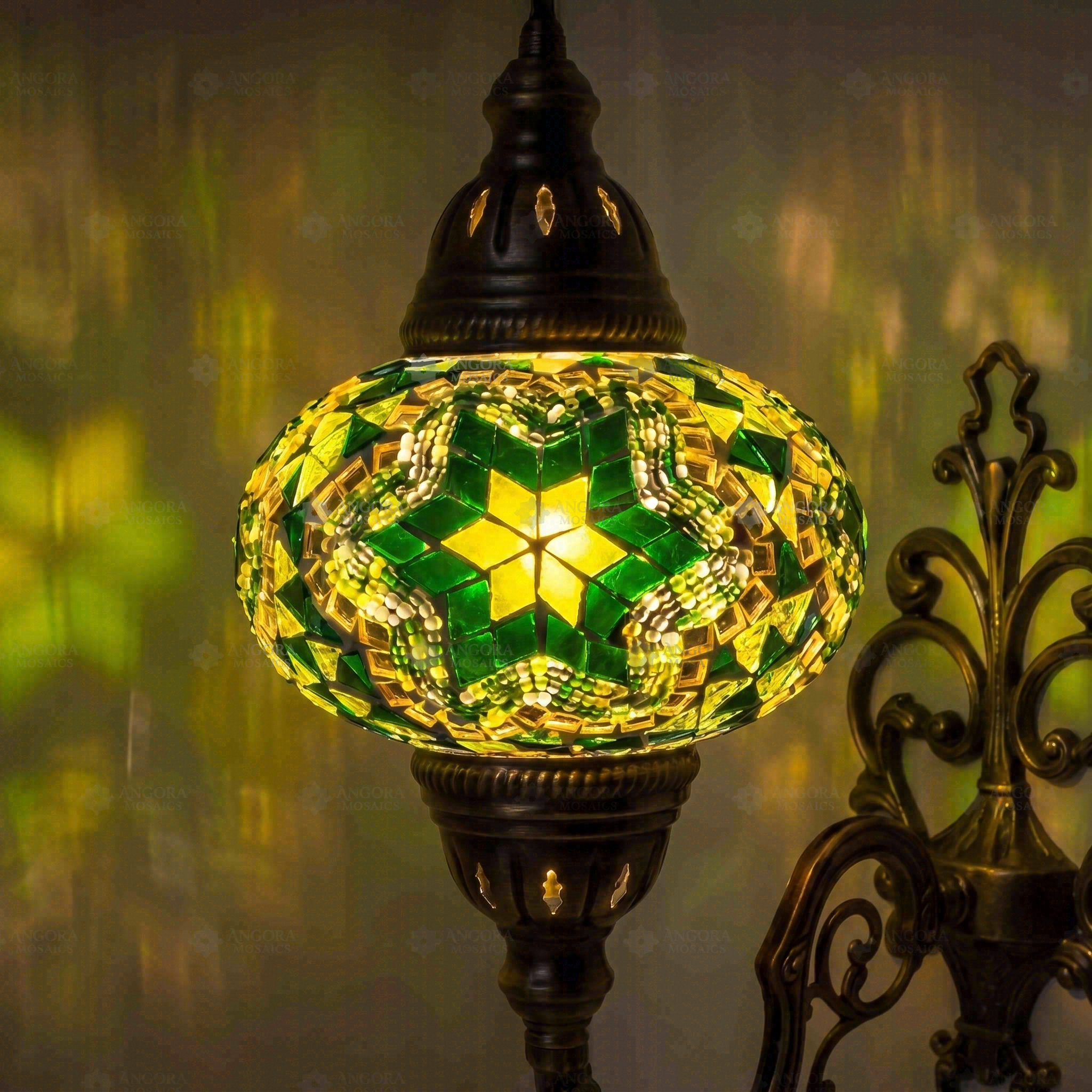 Lit close-up of mosaic glass globe — Green wall sconce glowing (ENV APN3003)