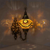Amber Turkish mosaic wall sconce illuminated, showing colorful light projection (ENV APN3009)