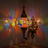 Multicolor Turkish mosaic wall sconce illuminated, showing colorful light projection (ENV APN3012)
