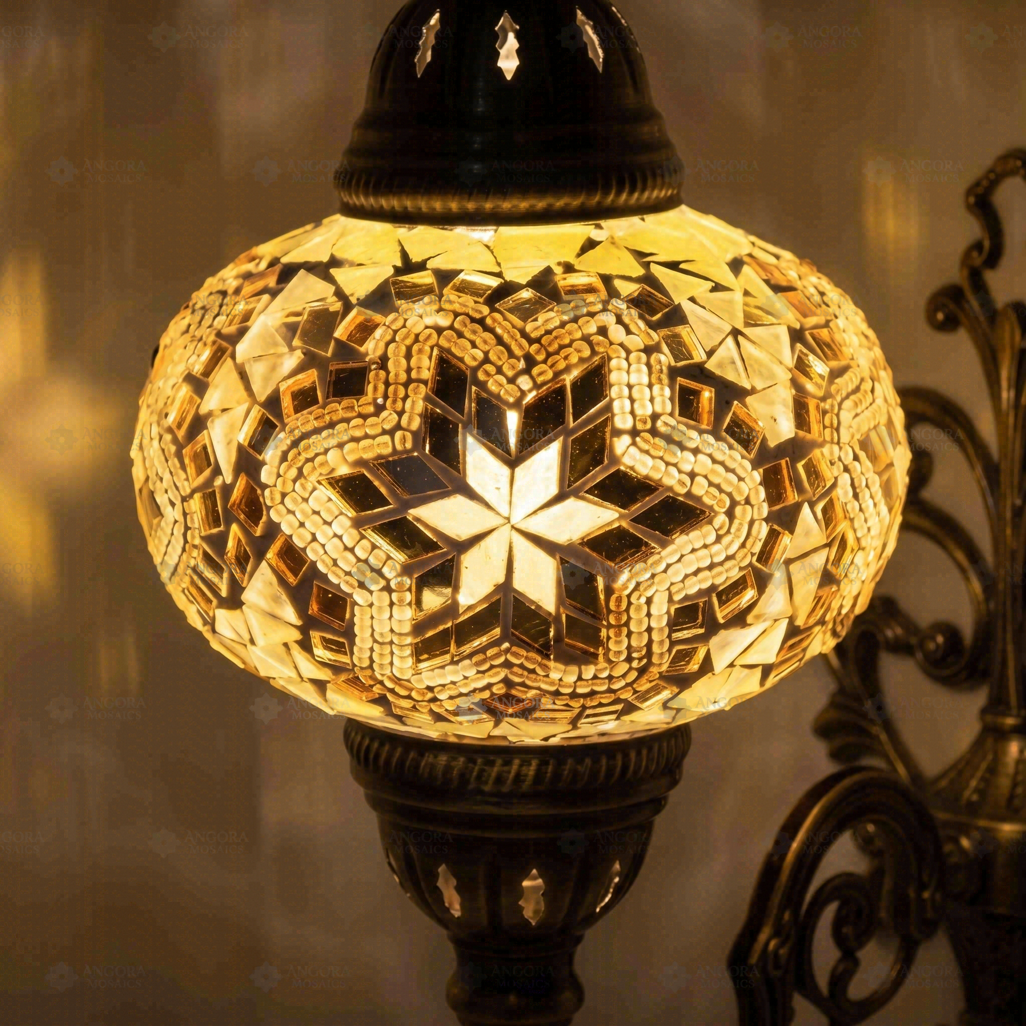 Lit close-up of mosaic glass globe — Clear wall sconce glowing (ENV APN3015)
