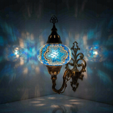 Blue Turkish mosaic wall sconce illuminated, showing colorful light projection (ENV APN3016)