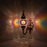Multicolor Turkish mosaic wall sconce illuminated, showing colorful light projection (ENV APN3018)