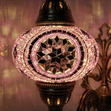 Lit close-up of mosaic glass globe — Pink wall sconce glowing (ENV APN3020)