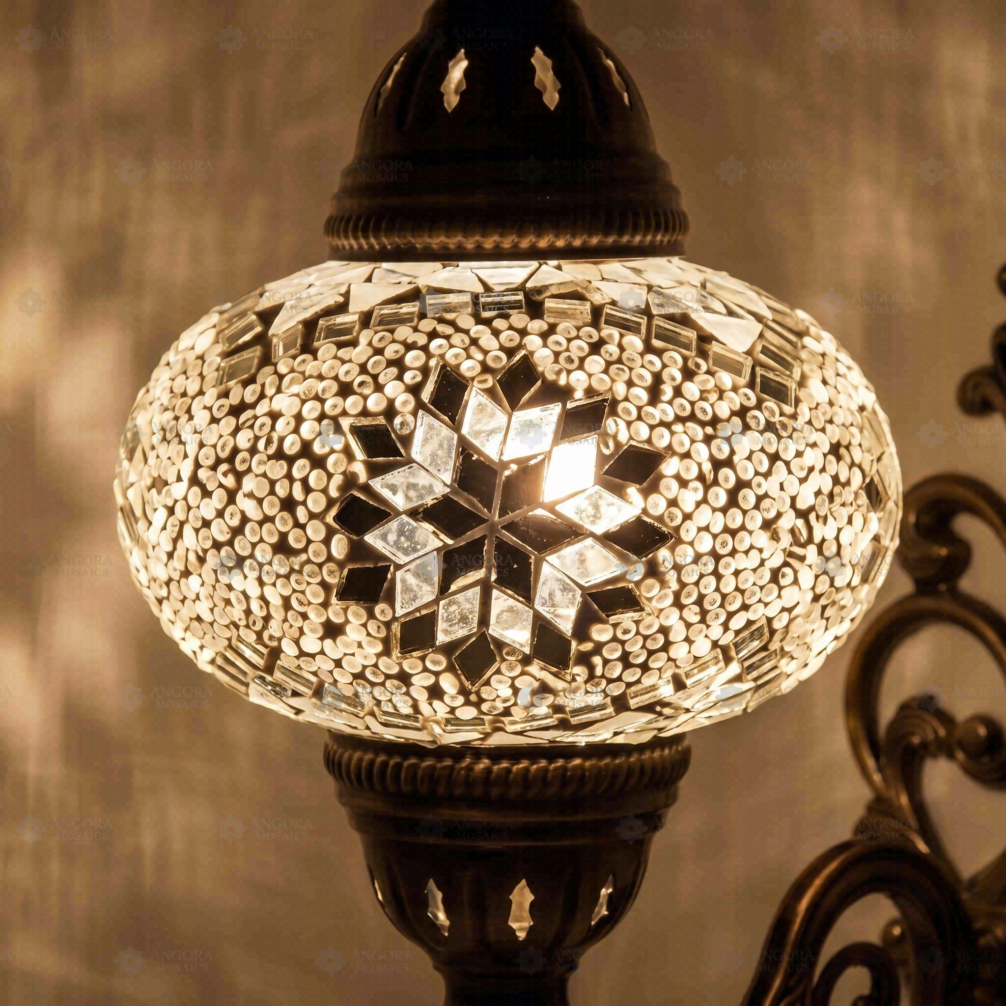 Lit close-up of mosaic glass globe — White wall sconce glowing (ENV APN3022)