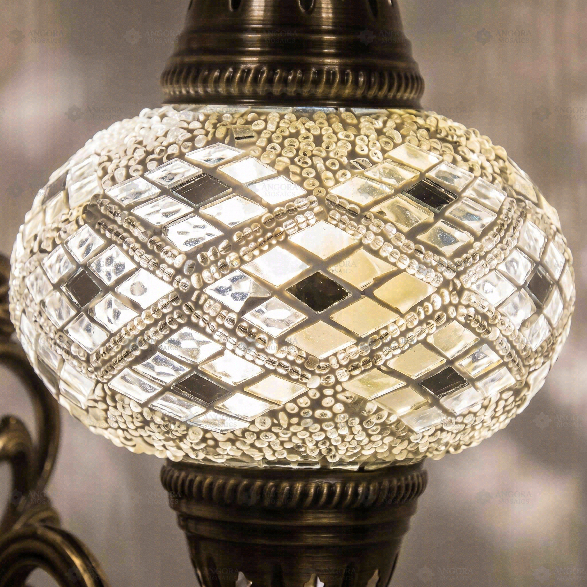 Lit close-up of mosaic glass globe — White wall sconce glowing (ENV APN3023)