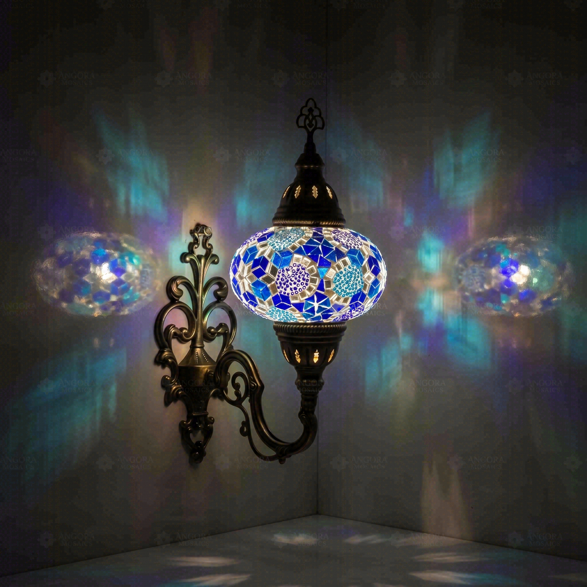 Blue Turkish mosaic wall sconce illuminated, showing colorful light projection (ENV APN3032)