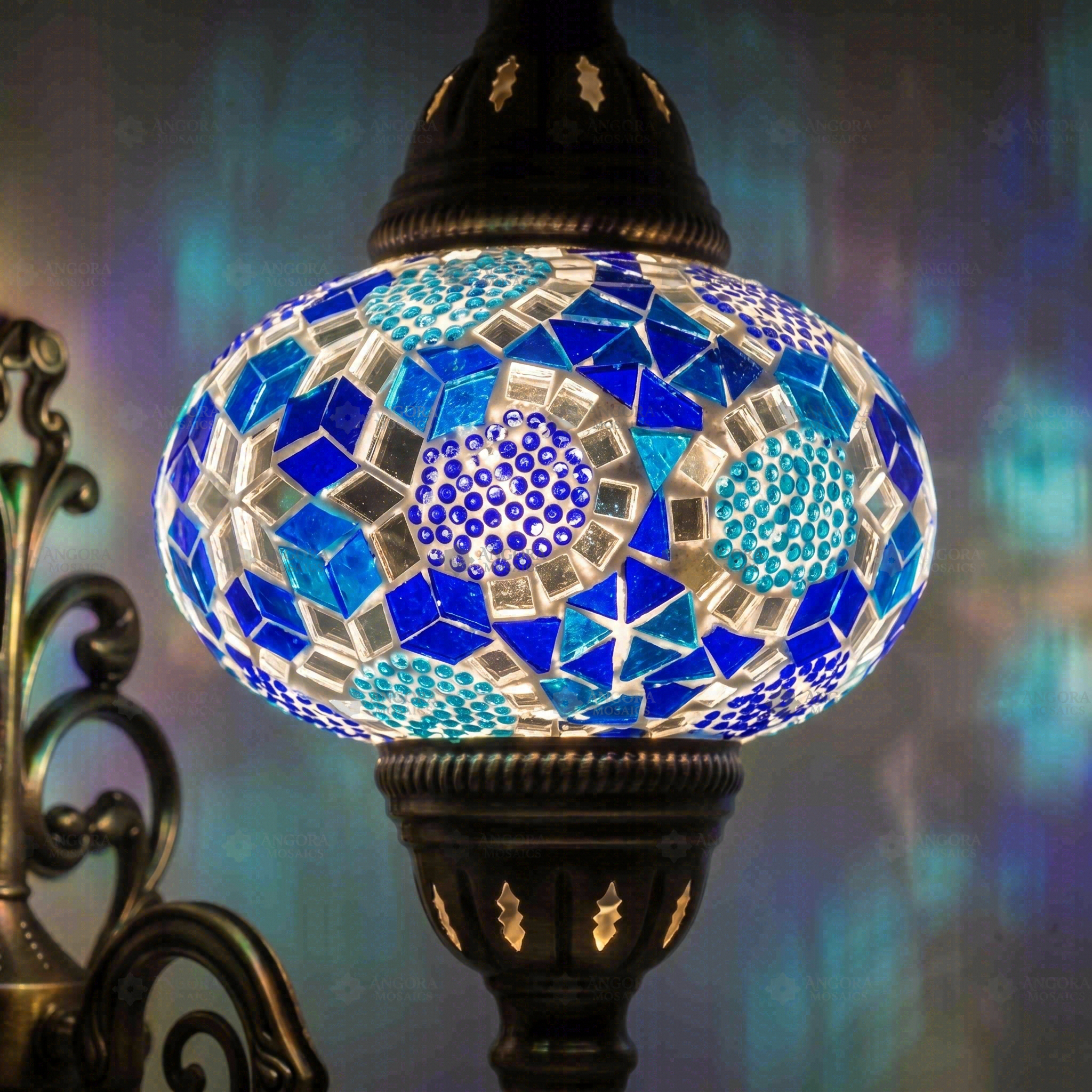 Lit close-up of mosaic glass globe — Blue wall sconce glowing (ENV APN3032)