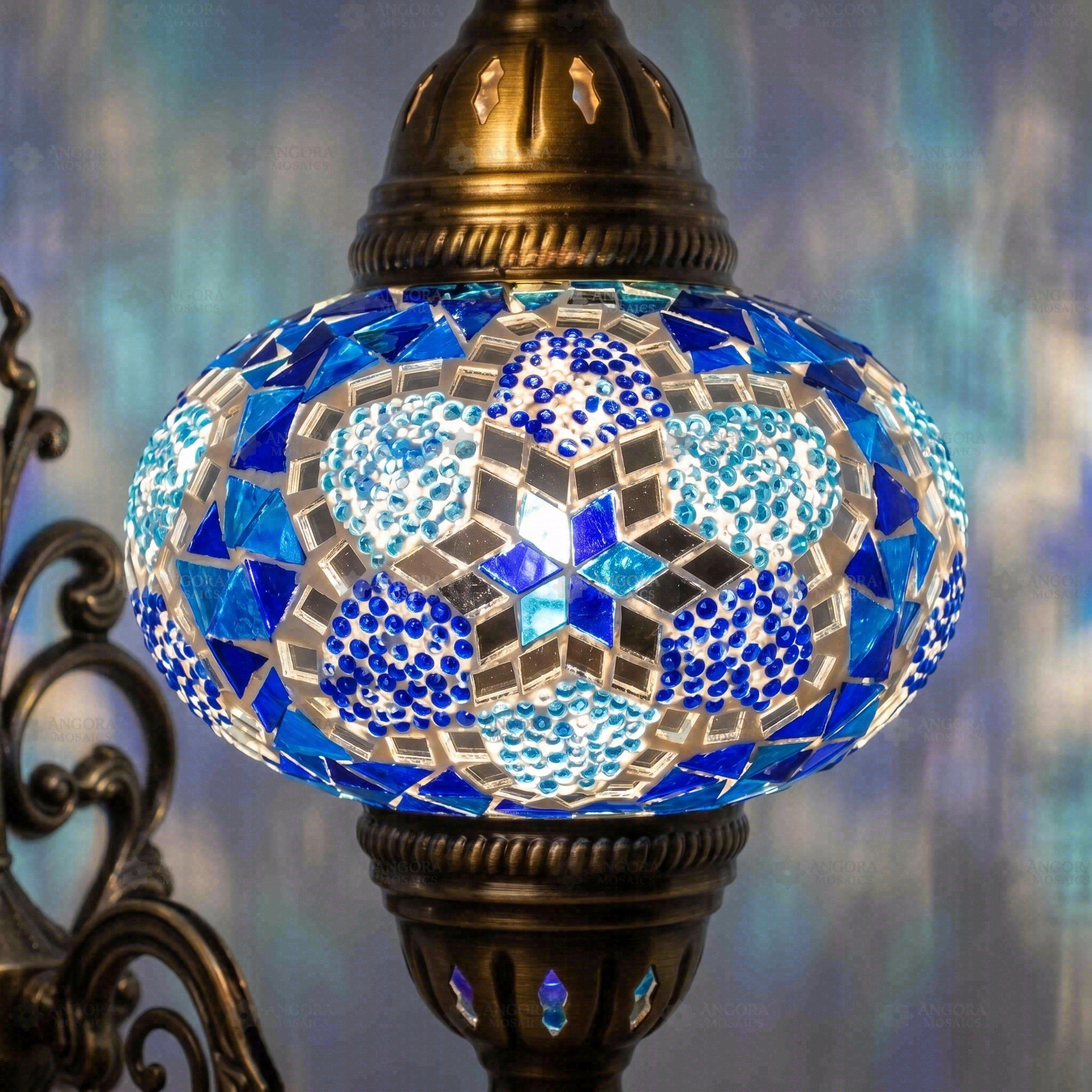 Lit close-up of mosaic glass globe — Blue wall sconce glowing (ENV APN3034)