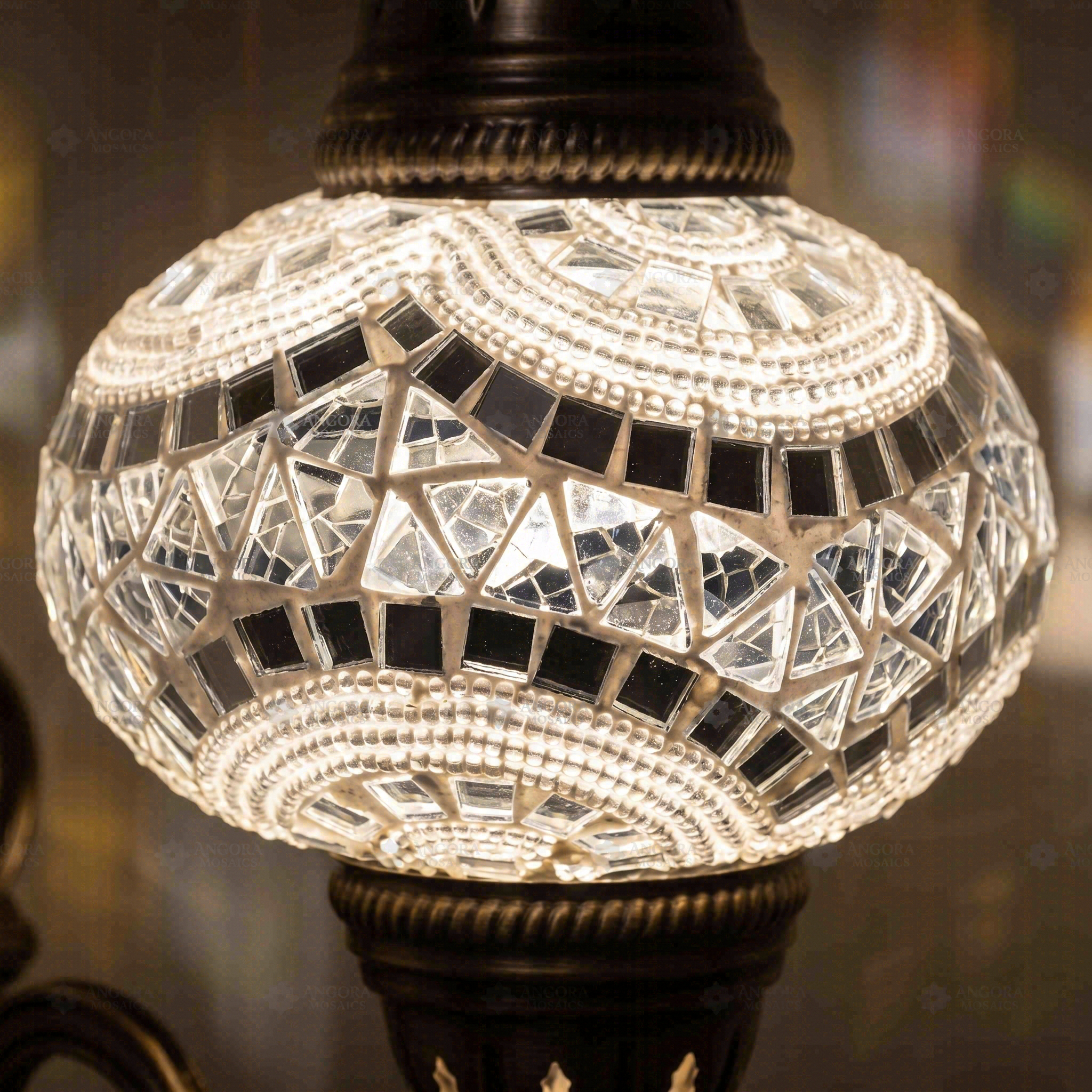 Lit close-up of mosaic glass globe — White wall sconce glowing (ENV APN3036)