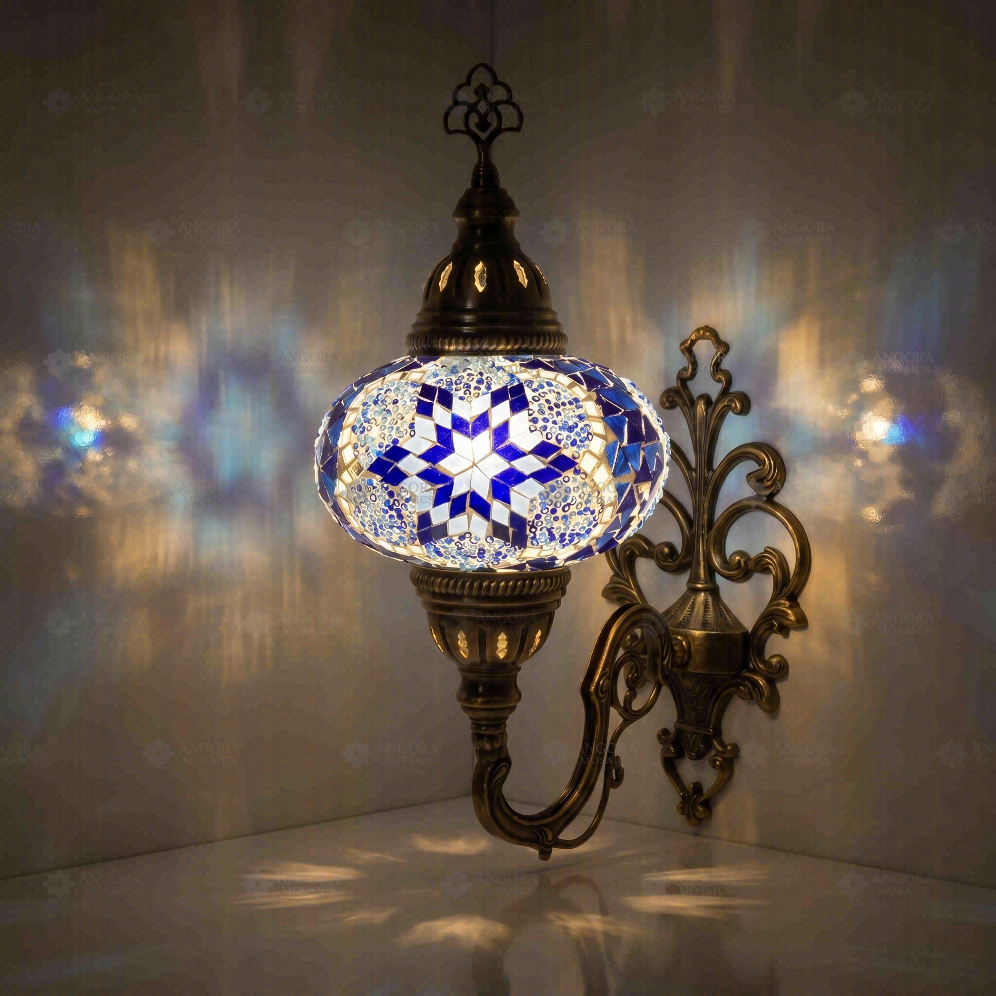 Blue Turkish mosaic wall sconce illuminated, showing colorful light projection (ENV APN3039)