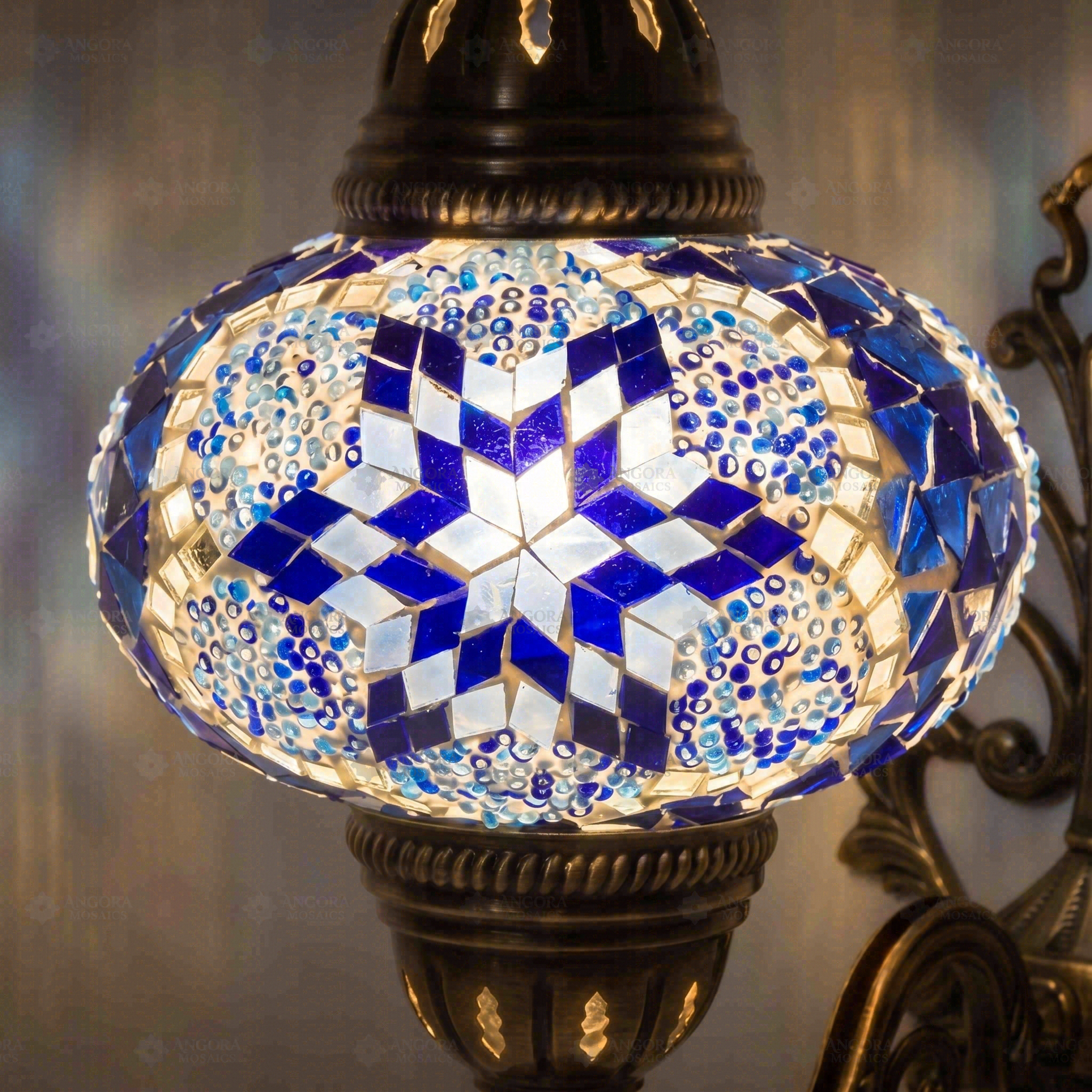 Lit close-up of mosaic glass globe — Blue wall sconce glowing (ENV APN3039)