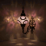 Purple Turkish mosaic wall sconce illuminated, showing colorful light projection (ENV APN3041)