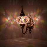Pink Turkish mosaic wall sconce illuminated, showing colorful light projection (ENV APN3046)