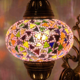 Lit close-up of mosaic glass globe — Pink wall sconce glowing (ENV APN3046)