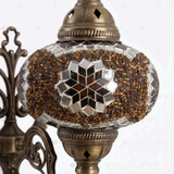 Close-up of Amber warm amber mosaic glass globe pattern — wall sconce (ENV APN3049)