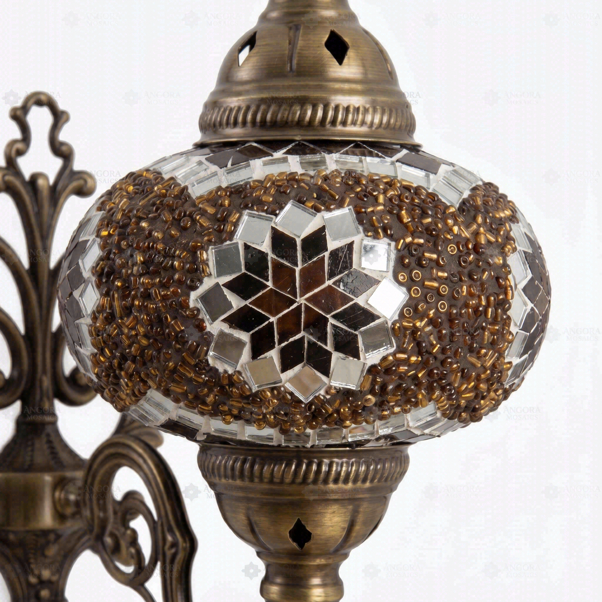 Close-up of Amber warm amber mosaic glass globe pattern — wall sconce (ENV APN3049)