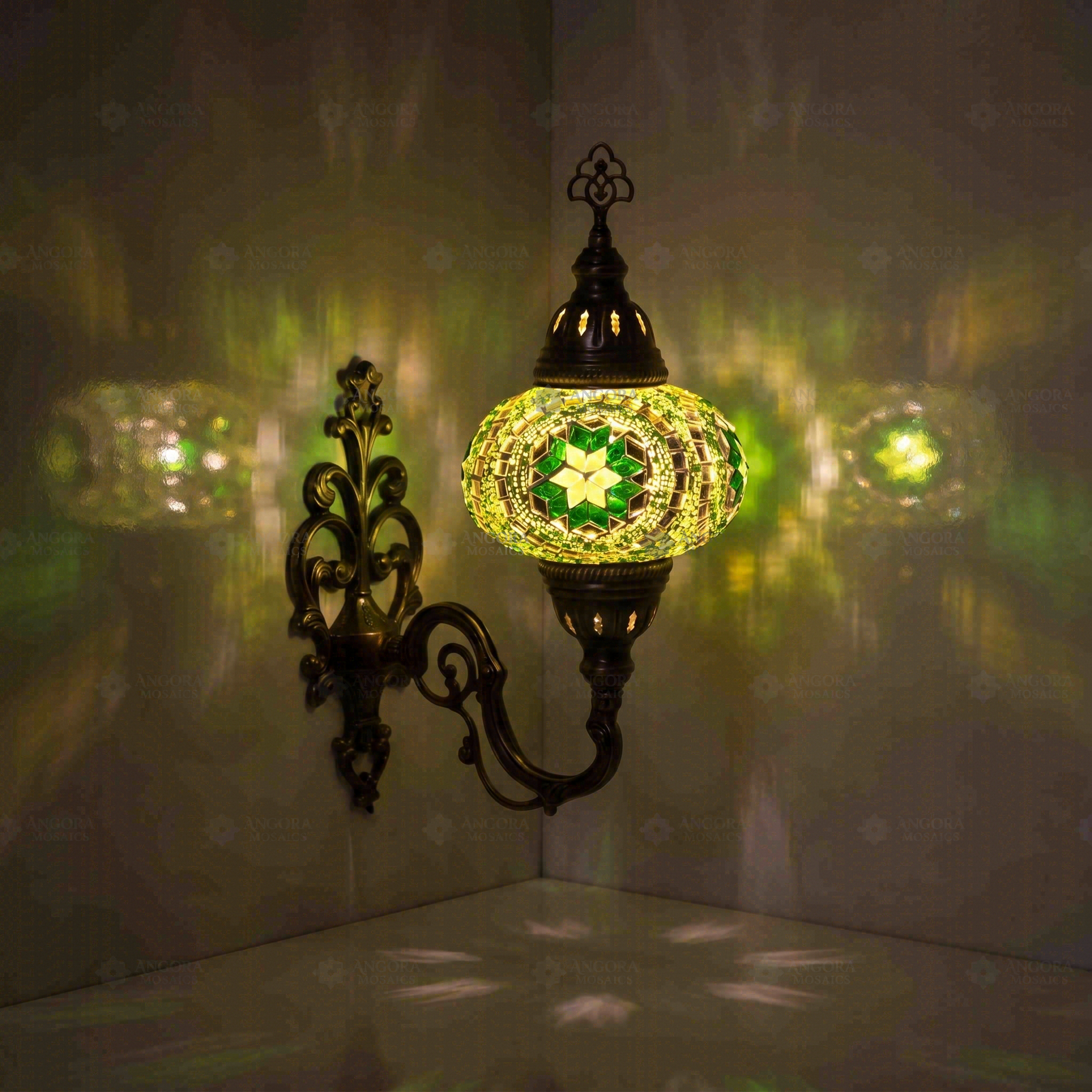 Green Turkish mosaic wall sconce illuminated, showing colorful light projection (ENV APN3050)