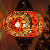 Lit close-up of mosaic glass globe — Red wall sconce glowing (ENV APN3052)