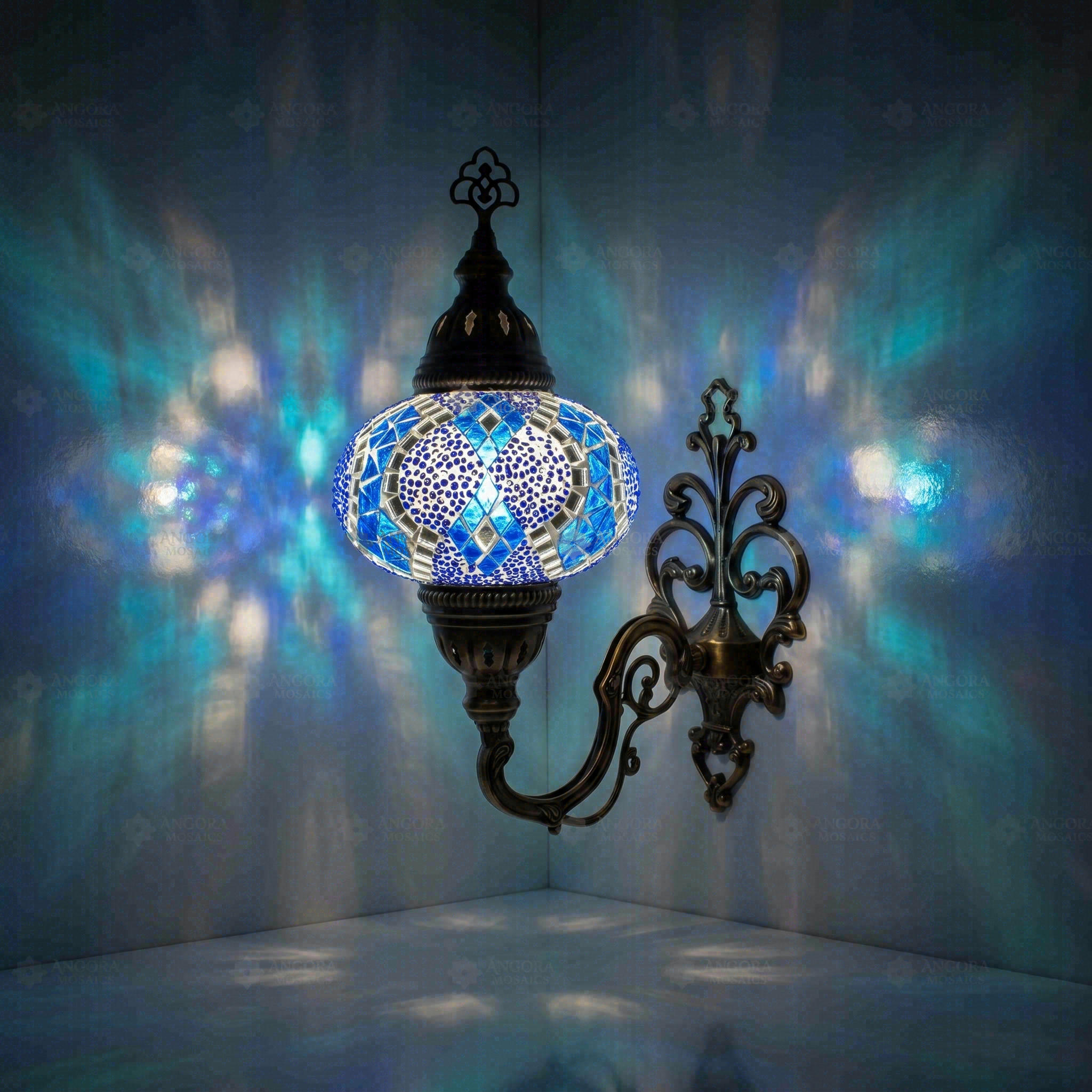 Blue Turkish mosaic wall sconce illuminated, showing colorful light projection (ENV APN3053)