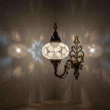 White Turkish mosaic wall sconce illuminated, showing colorful light projection (ENV APN3054)