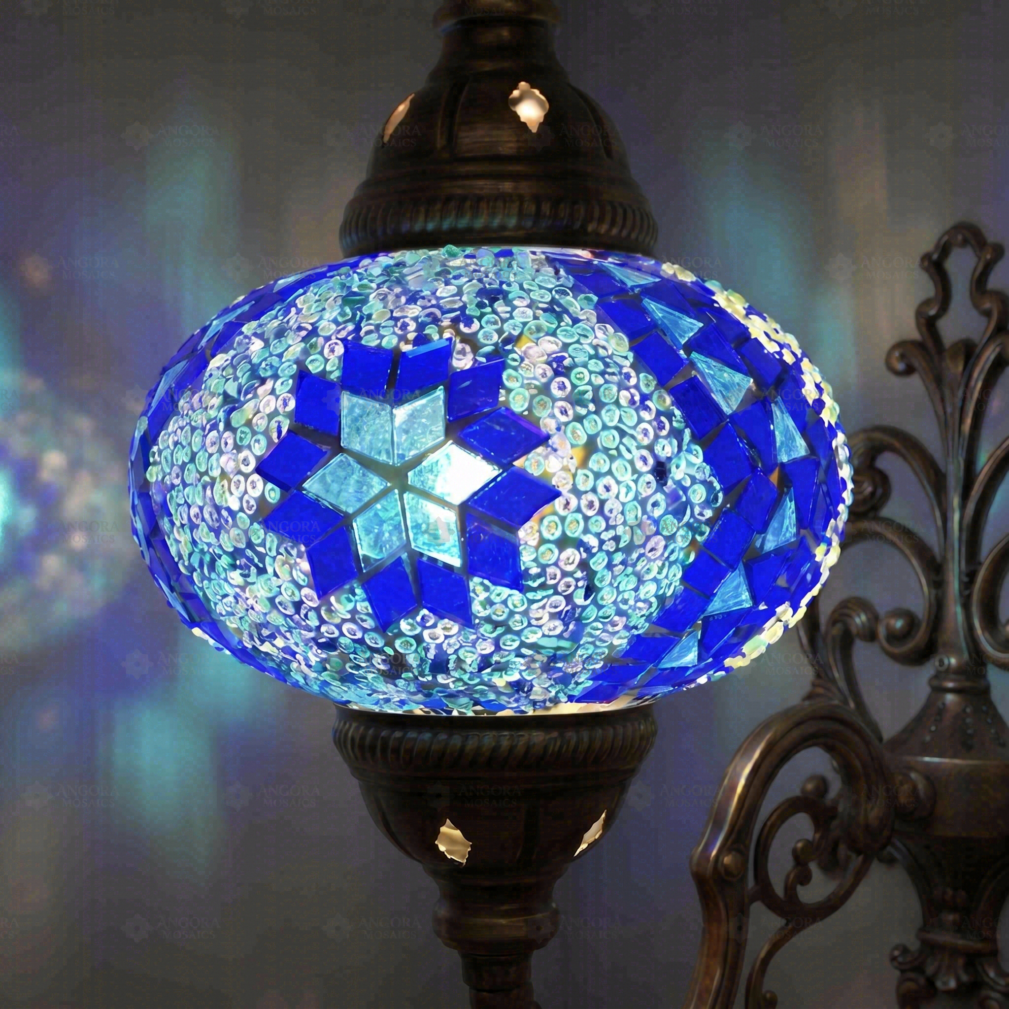 Lit close-up of mosaic glass globe — Blue wall sconce glowing (ENV APN3058)