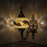Amber Turkish mosaic wall sconce illuminated, showing colorful light projection (ENV APN3064)
