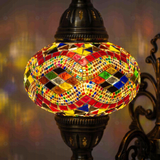 Lit close-up of mosaic glass globe — Multicolor wall sconce glowing (ENV APN3074)