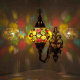 Multicolor Turkish mosaic wall sconce illuminated, showing colorful light projection (ENV APN3091)