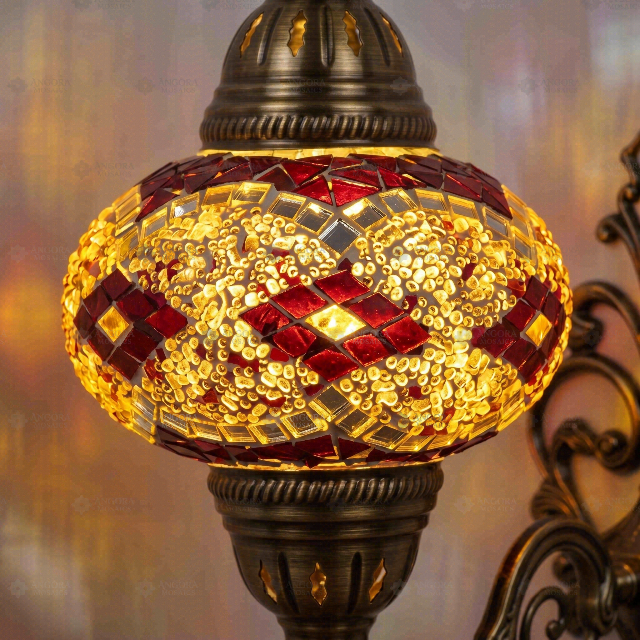 Lit close-up of mosaic glass globe — Amber wall sconce glowing (ENV APN3092)