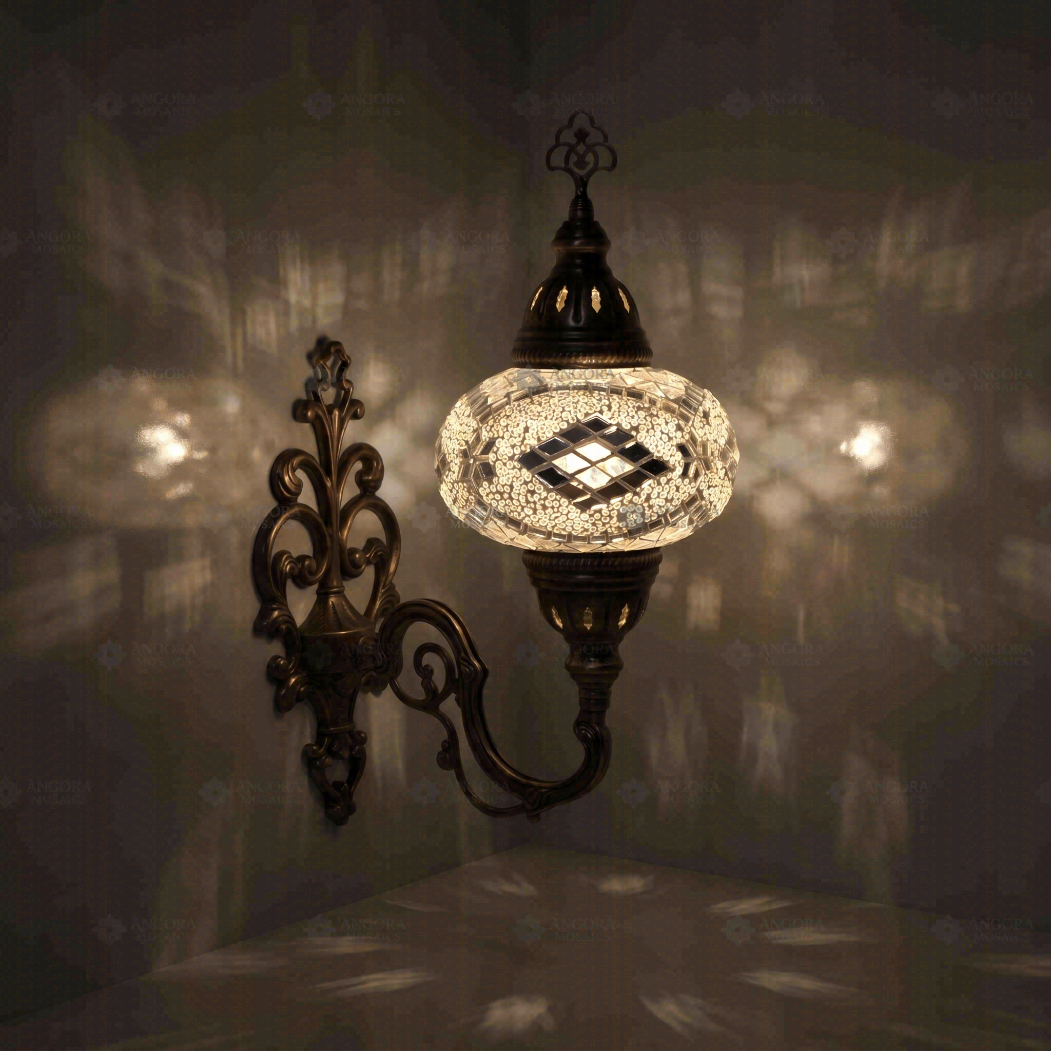 Clear Turkish mosaic wall sconce illuminated, showing colorful light projection (ENV APN3098)