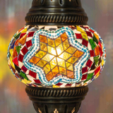 Lit close-up of mosaic glass globe — Multicolor table lamp glowing (ENV DVN1042)