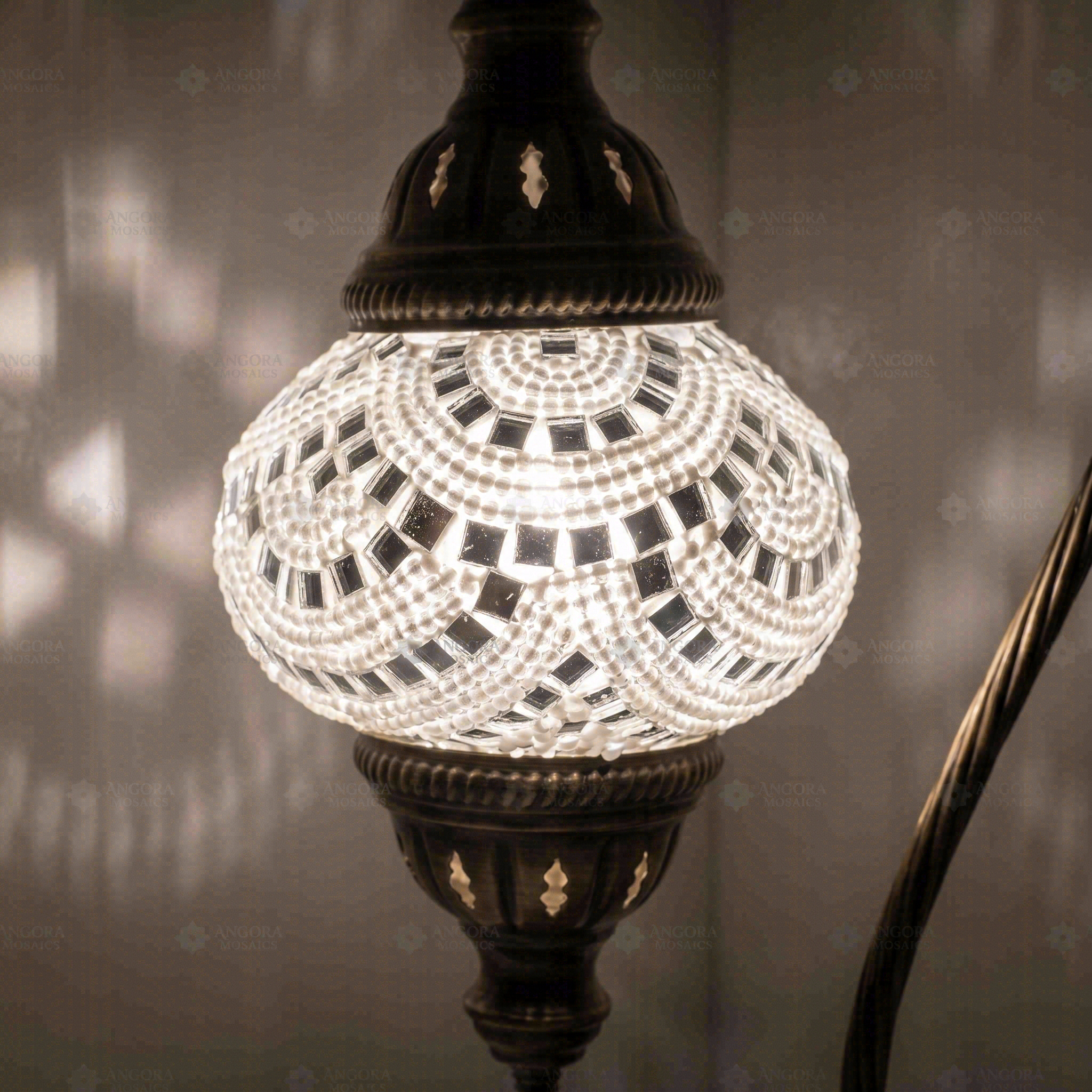 Lit close-up of mosaic glass globe — White table lamp glowing (ENV DVN2001)