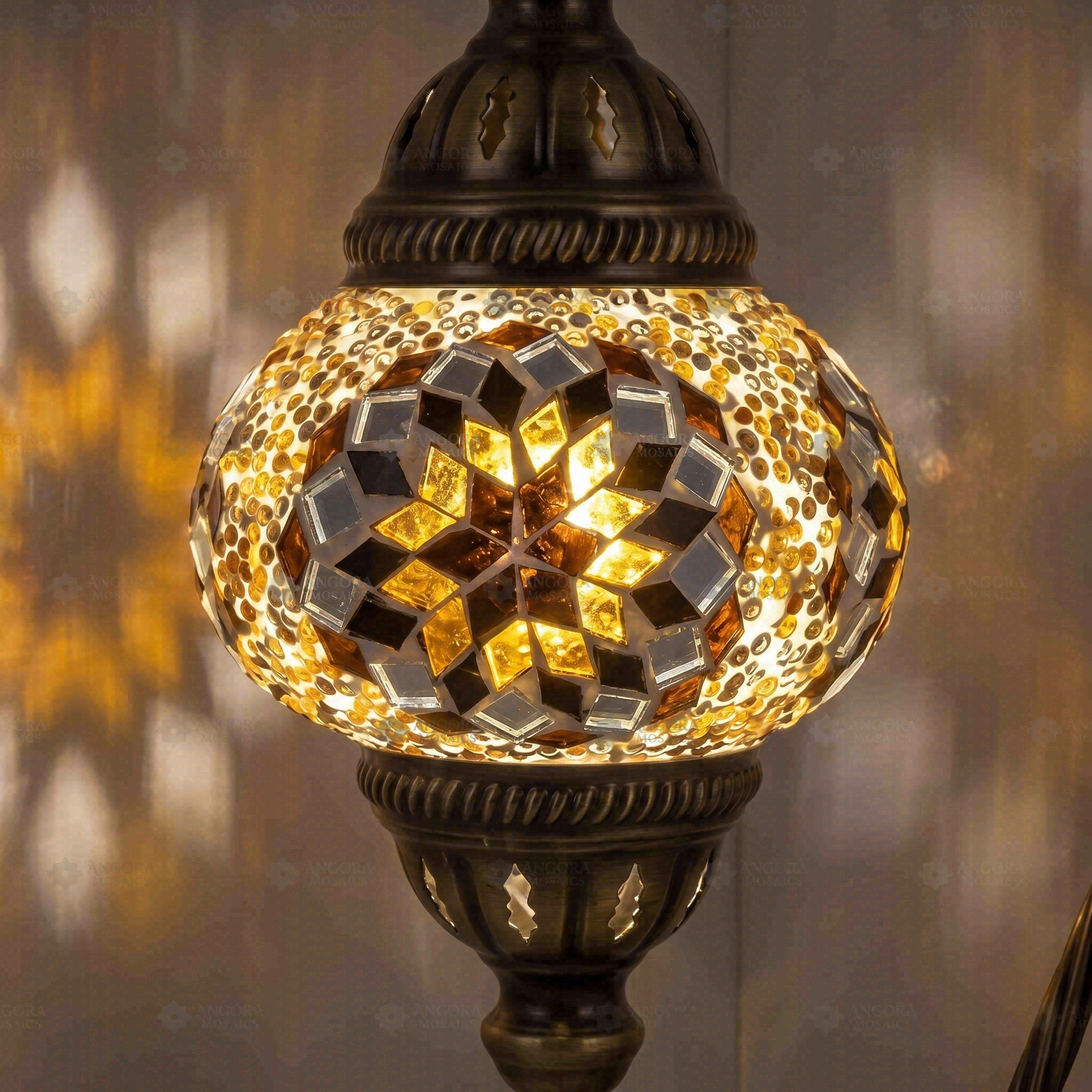Lit close-up of mosaic glass globe — Amber table lamp glowing (ENV DVN2118)