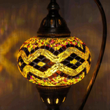 Lit close-up of mosaic glass globe — Warm Tones table lamp glowing (ENV DVN3013)