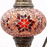 Close-up of Amber warm amber mosaic glass globe pattern — table lamp (ENV DVN3025)