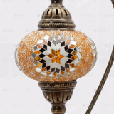 Close-up of Amber warm amber mosaic glass globe pattern — table lamp (ENV DVN3026)