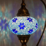 Lit close-up of mosaic glass globe — Blue table lamp glowing (ENV DVN3027)