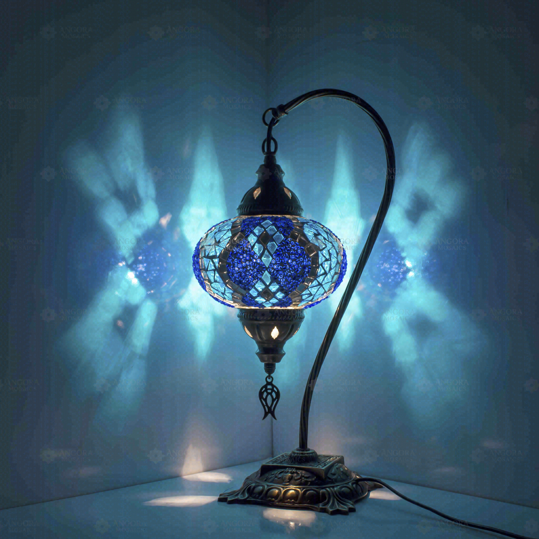 Blue Turkish mosaic table lamp illuminated, showing colorful light projection (ENV DVN3053)