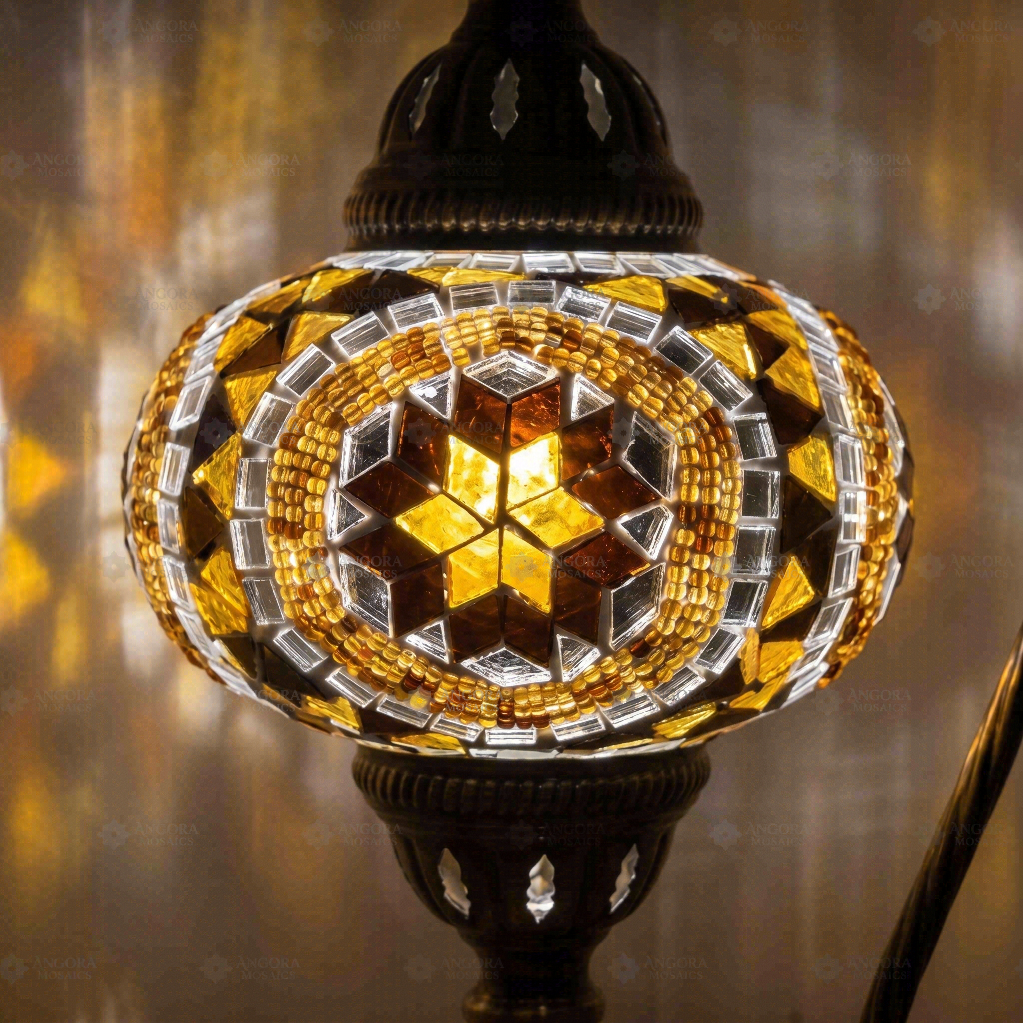 Lit close-up of mosaic glass globe — Amber table lamp glowing (ENV DVN3067)