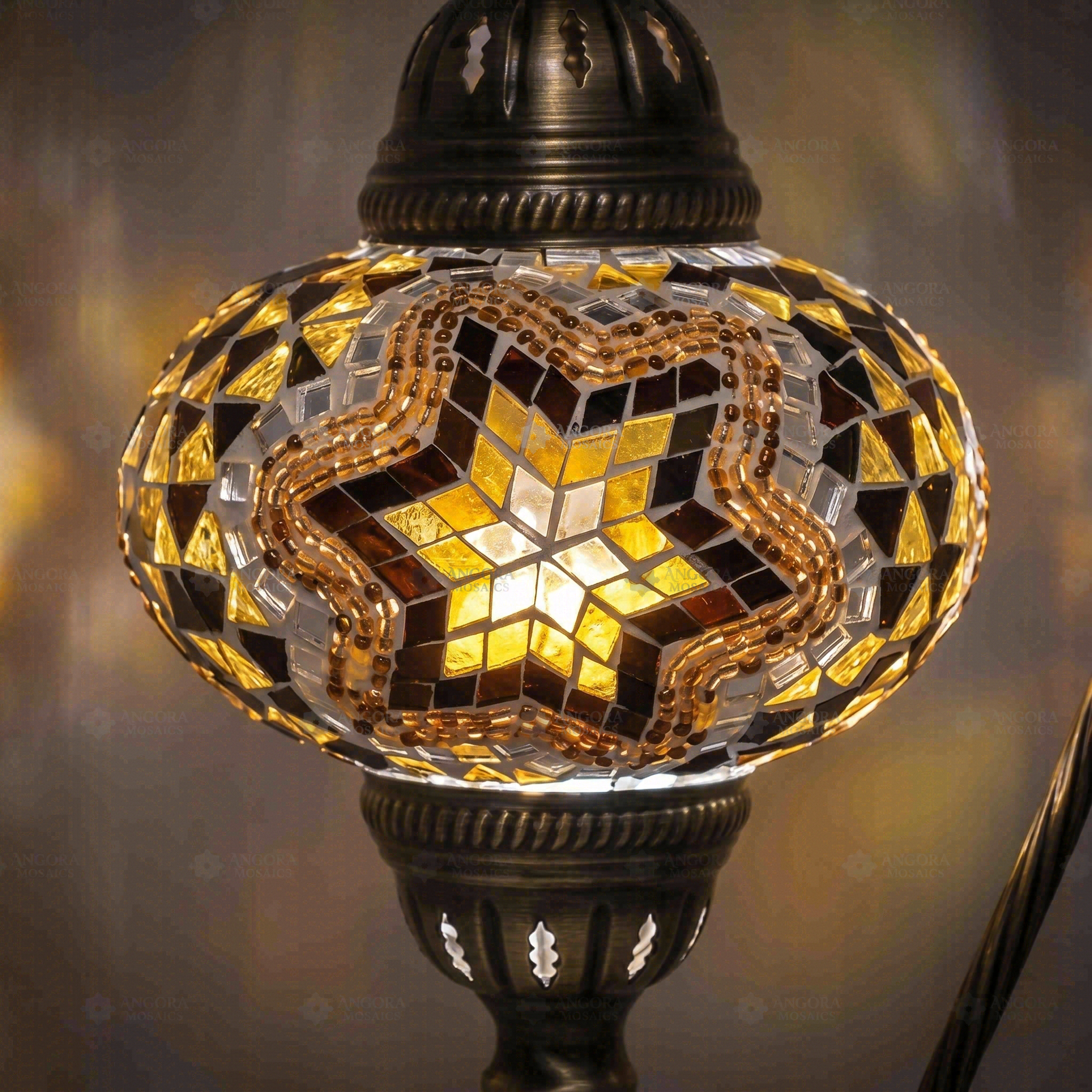 Lit close-up of mosaic glass globe — Amber table lamp glowing (ENV DVN3088)
