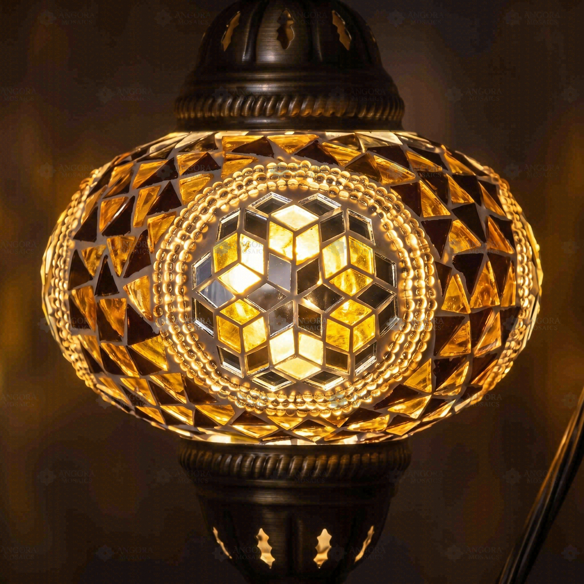 Lit close-up of mosaic glass globe — Amber table lamp glowing (ENV DVN3089)