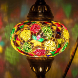 Lit close-up of mosaic glass globe — Multicolor table lamp glowing (ENV DVN3091)