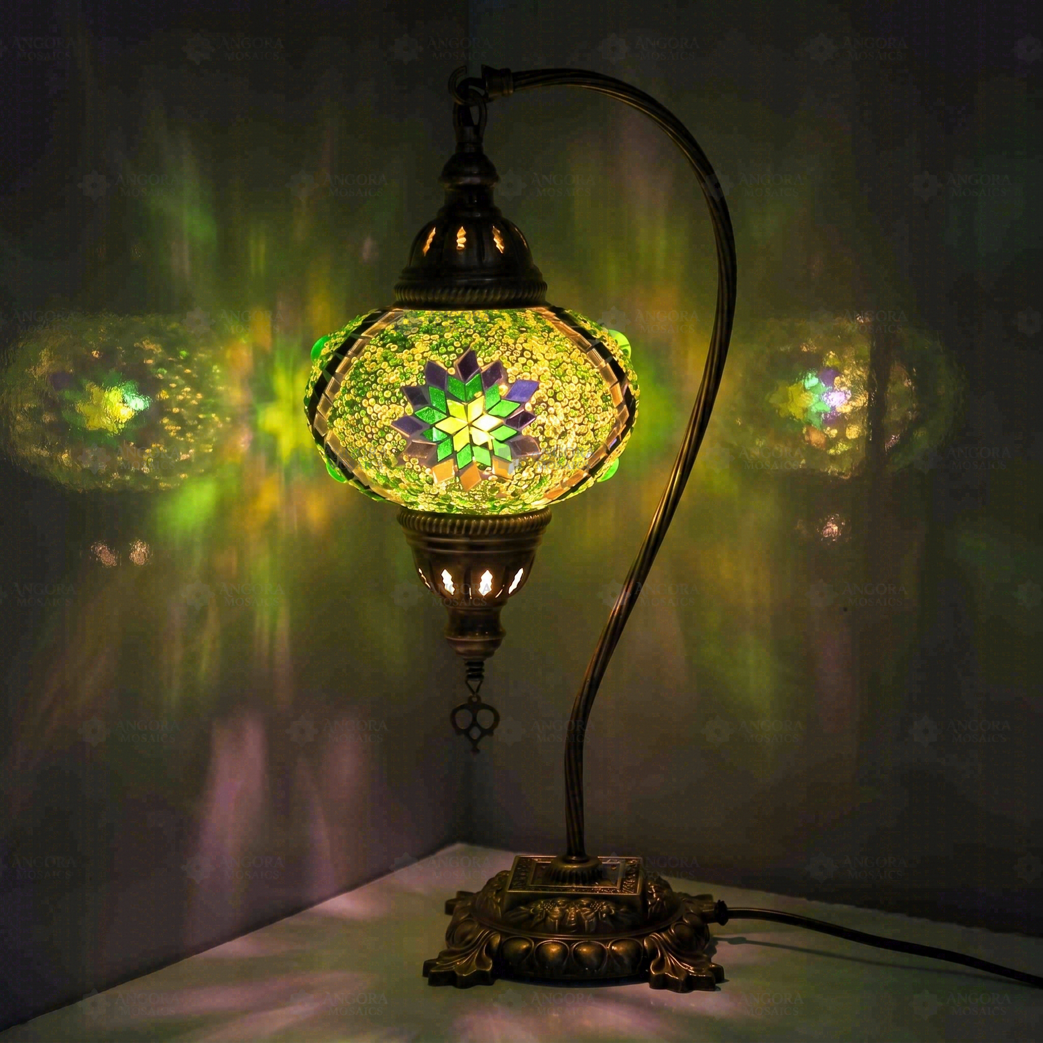 Green Turkish mosaic table lamp illuminated, showing colorful light projection (ENV DVN3096)